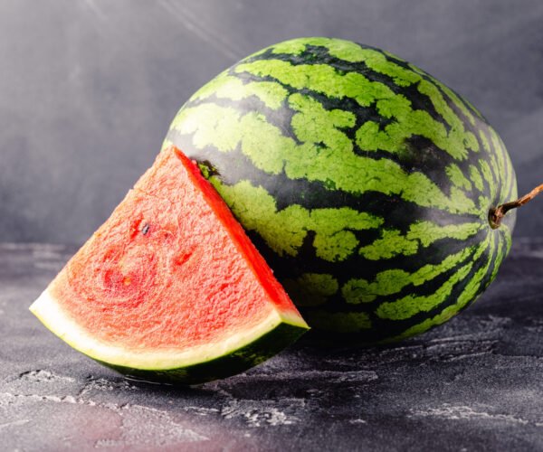 Fresh tasty delicious watermelon on a dark background Fresh tasty delicious watermelon on a dark background, selective focus